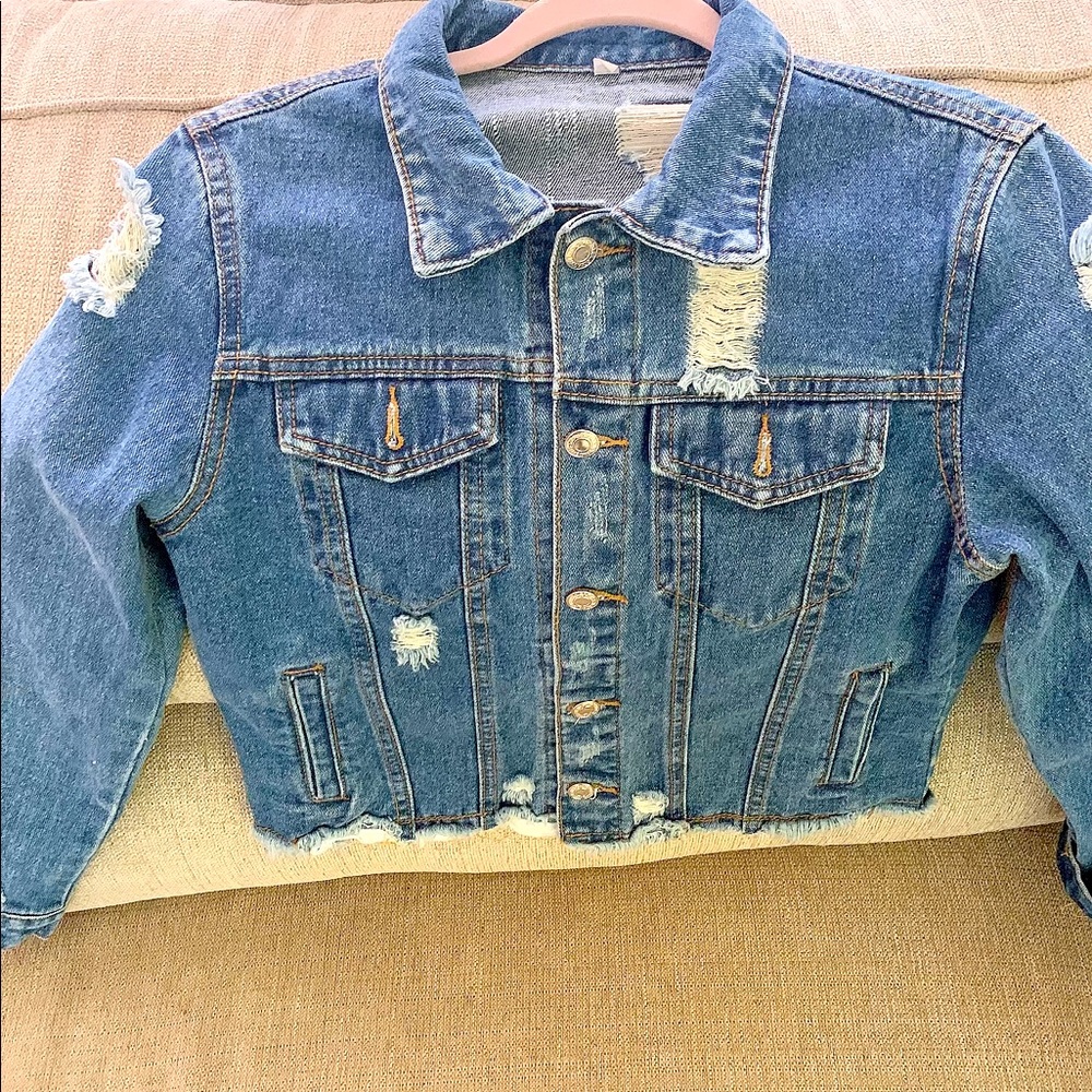 Distressed jeans jacket